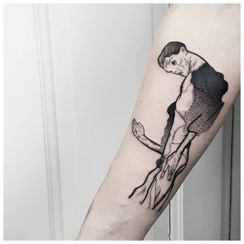 Silhouette d'homme - tatouage sur le bras de l'homme