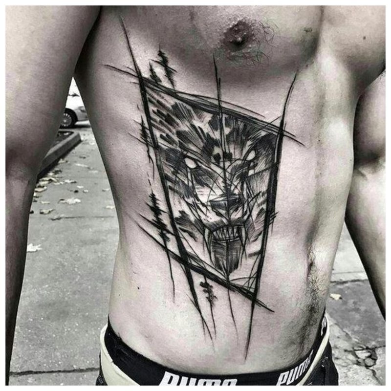 Tatuaj de lup pe corpul unui bărbat