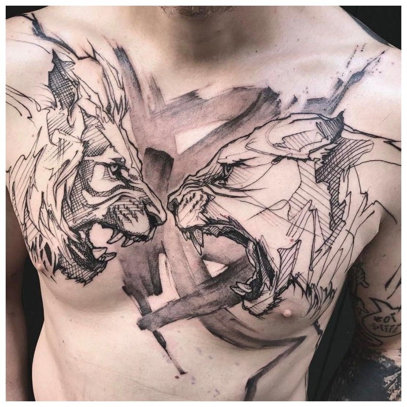 2 pikti gyvūnai - tatuiruotė ant vyro krūtinės